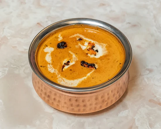 Butter chicken in a creamy orange curry sauce at Lutf Indo-Pak Cuisine
